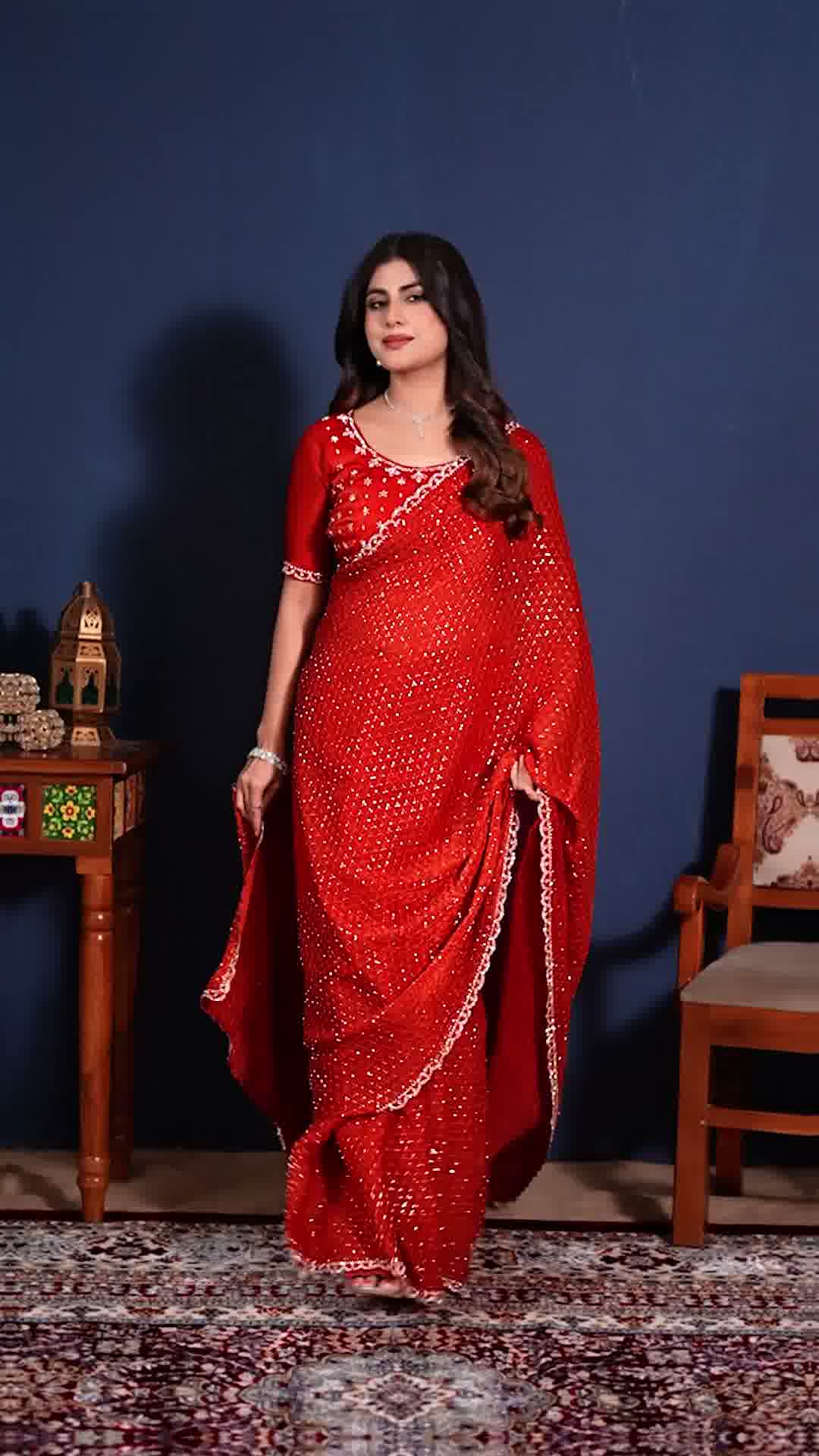 Premium red embellished saree with a designer border for festive and party wear