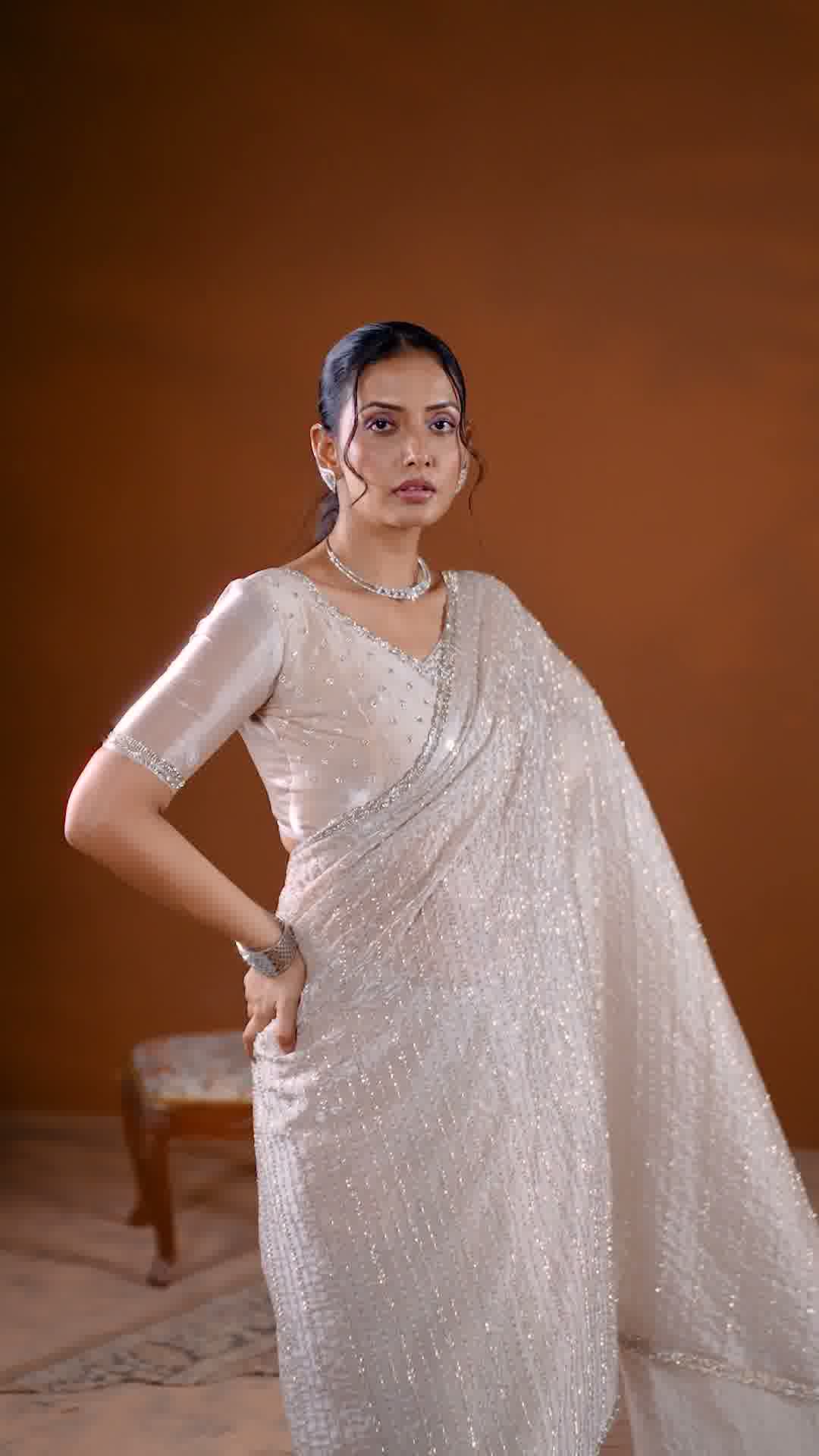 Premium ivory saree with silver embellishment and designer detailing