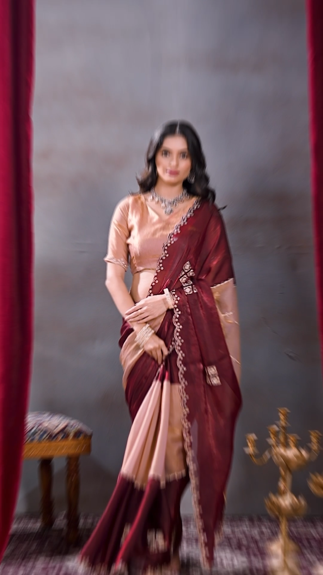 Wine and peach Fandy silk designer saree with an embellished border