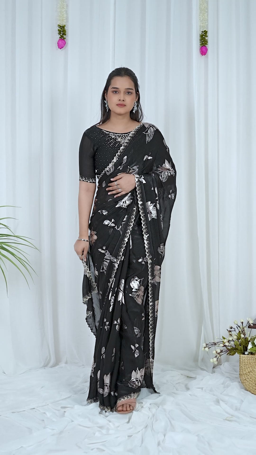 Video of the black Fandy foil print saree with silver floral design