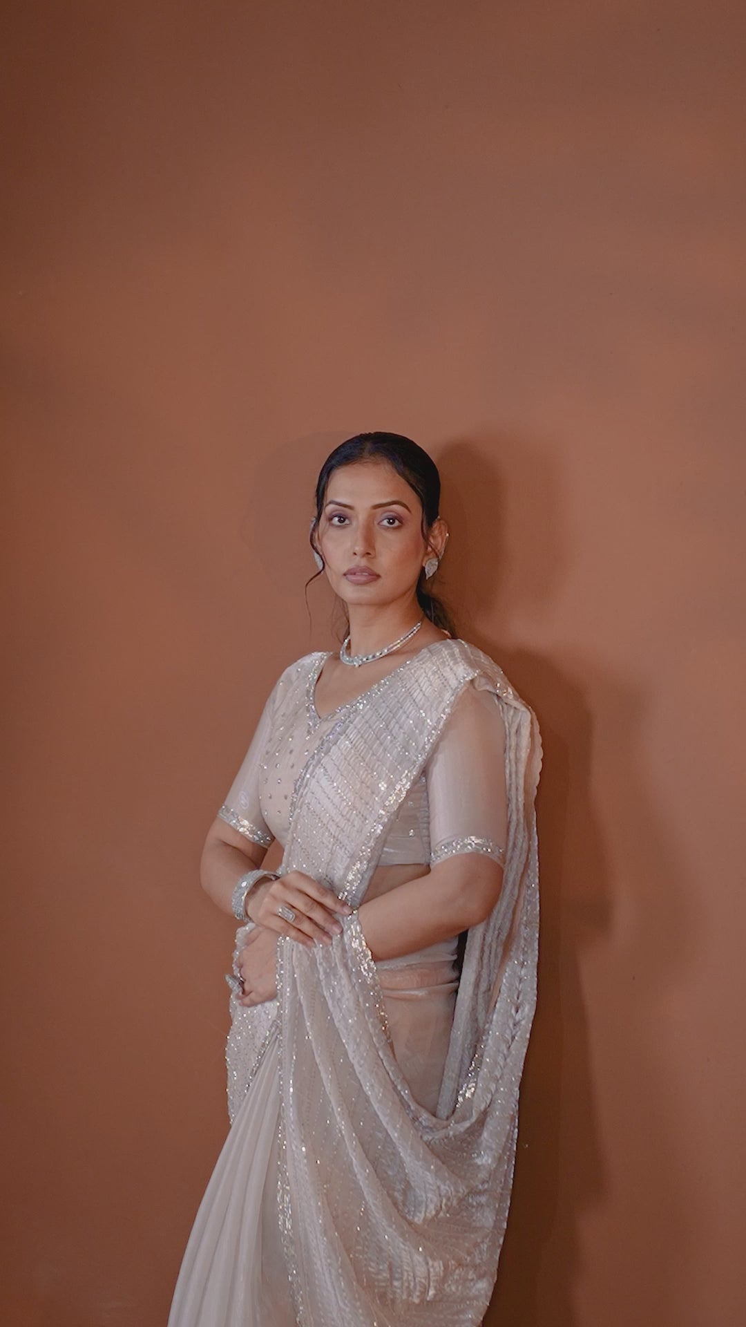 Video of the ivory and silver embellished designer saree